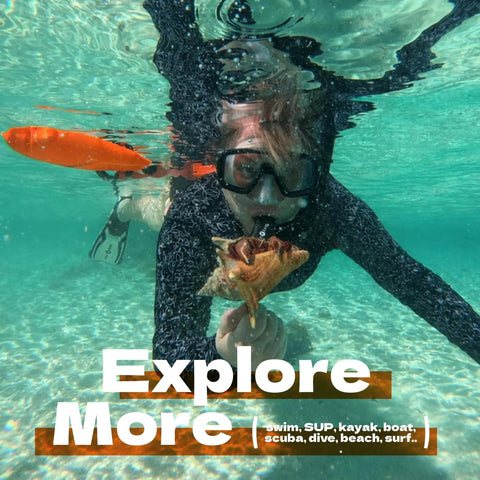 Swimmer underwater with Open Water Swim Buoy With 15L Dry Bag and Rest Handle, high visibility orange in clear water.