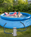 2 Pack 1.25 Inch By 59 Inch EVA Pool Replacement Hoses attached to blue above ground pool with pump system
