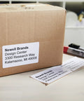 Heavy Duty Shipping Labels With Sleek Peel Off Backing Drop Right On Parcels For Instant Prep Works Dead Simple With Labelwriter Printers Using Direct Thermal Tech To Dodge Ink Bills Captures Six Line Addresses On Popular 2 5 16 By 4 Inch Rolls Holding on cardboard box.