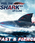 Fast Brushless RC Boat For Adults With Self Righting Hull cutting through water, realistic fins visible, LED lights on.