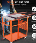 Rock Solid Welding Workbench Table 35X24 Inches With Lockable Swivel Casters And Adjustable Tool Tray Heavy Duty Carbon Steel Fabrication Bench in use.
