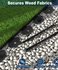 Black 40 Ft Landscape Edging Border Kit with 40 Spikes, 2 Inch High shown installed in garden with lawn and pebbles