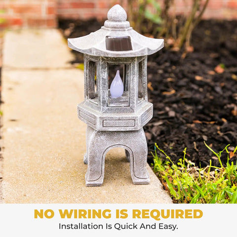 Solar Powered Pagoda Garden Statue With Flickering LED Lantern Outdoor Zen Decor For Calm Vibes In Your Yard Japanese Style Yard Light 13 Inch Tall Polyresin Pagoda With Auto On At Dusk placed on patio