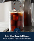 Dedica Duo Compact Espresso Machine With Milk Frother Wand for Espresso Cold Brew dispensing iced coffee into a glass