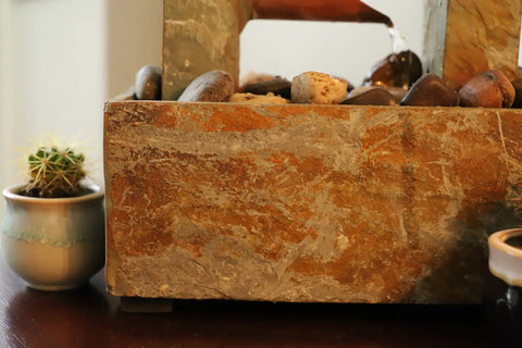 Spillway Rustic Indoor Tabletop Water Fountain With Slate And Copper Finish, detail of slate texture and stones with cactus