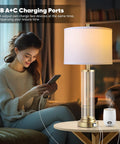 Woman using Touch Control Bedside Lamps Set Of 2 With USB A And C Ports, 3 Way Dimmable Nightstand Lighting With Fabric Shade