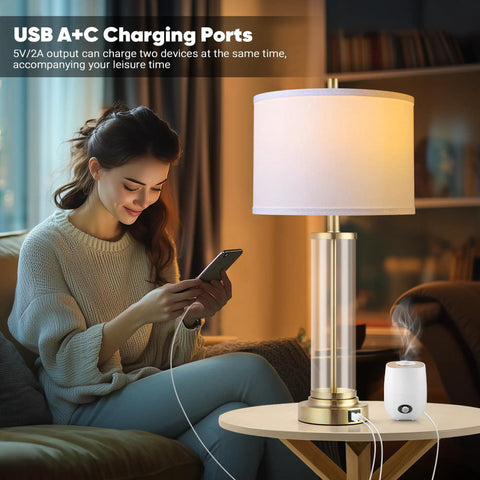 Woman using Touch Control Bedside Lamps Set Of 2 With USB A And C Ports, 3 Way Dimmable Nightstand Lighting With Fabric Shade
