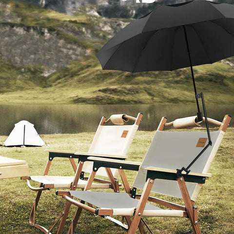 A Zero Stress UV Defense This Upf Fifty Plus Golf Umbrella packs a heavy duty clamp over black deck chairs by a lake.