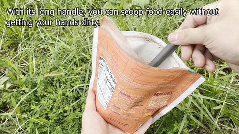 Ultra Lightweight Titanium Long Handle Spork With Polished Bowl used to scoop meal from pouch during camping.