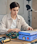 Person using Powerful 850W Soldering Hot Plate with 110V LED Microcomputer Controller on a circuit board, precise work station.