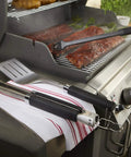 Precision 3 Piece Grilling Tool Set With Stainless Steel Tongs Spatula And Silicone Basting Brush on a grill