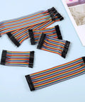 Dope Multicolor Breadboard Jumper Wire Kit 240Pcs with 10Cm and 20Cm cables, arranged, featuring 10 distinct colors for prototyping.