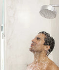 Man enjoying a hot shower with water from a chrome showerhead, illustrating the Score Instant Hot Water With This Beast-Mode 26.9 KW Electric Tankless Water Heater Engineered For Full Whole-House Flow With Zero Fuss Super Easy Install For Any Gig 3Phase 240V Power Gets You Streaming Hot Water Fast Reliable Goods For Home Or Business.