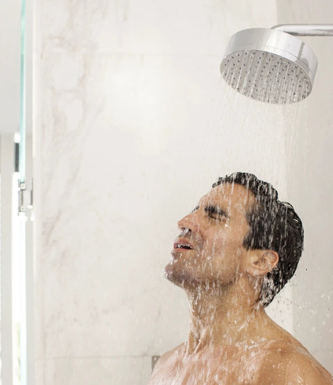 Man enjoying a hot shower with water from a chrome showerhead, illustrating the Score Instant Hot Water With This Beast-Mode 26.9 KW Electric Tankless Water Heater Engineered For Full Whole-House Flow With Zero Fuss Super Easy Install For Any Gig 3Phase 240V Power Gets You Streaming Hot Water Fast Reliable Goods For Home Or Business.