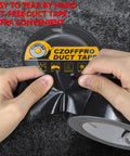 Hands tearing Heavy Duty Duct Tape Ultra Strong With Waterproof Backing For Indoor Outdoor Use Easy Tear By Hand.