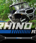 Beefed Up Rhino 2.0 Heavy Duty Rear Axles For Polaris RZR on display with off-road vehicle and logo