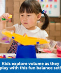 Child using Primary Bucket Balance Teaching Scale For Kids Hands On STEM Learning Tool With Removable Buckets in classroom.