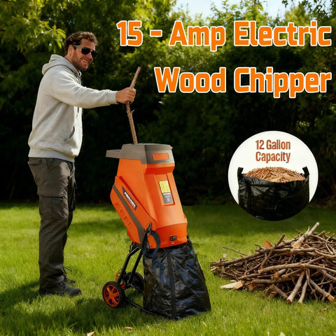 Man using a 15 Amp Electric Wood Chipper Shredder with Collection Bag and Push Stick on a grassy lawn, pile of branches nearby.