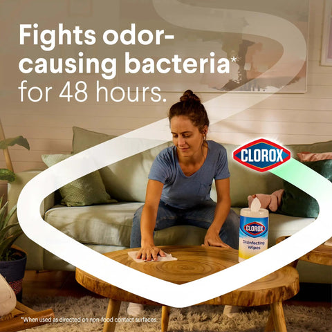 Person cleaning table with Disinfecting Cleaning Wipes With Sparkling Lemon Scent Antibacterial And Bleach Free Safe On 100 Plus Surfaces 75 Count