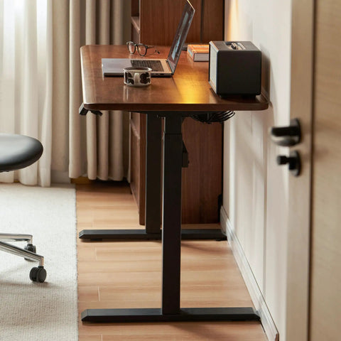 Top Shelf Electric Standing Desk With Ultra Wide Worktop Effortless Height Adjustment Hidden Wire Basket Natural Walnut Finish close-up of worktop and base