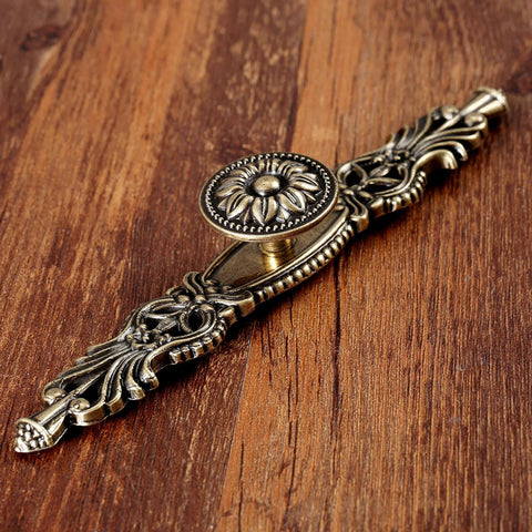 Vintage Cabinet Pulls Set of 5 in Antique Bronze on wooden surface showing detailed design and craftsmanship with 3.7 inch hole spacing