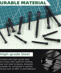 Close-up of 50 Pcs Highpoint Confirmat Screws Flat Head Countersunk Black Zinc Plated Furniture Connectors M7 x 40mm on green mat.