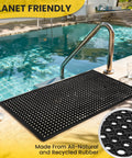 Heavy Duty Rubber Floor Mat With Drainage Holes For Garage Kitchen Restaurant And Outdoor Bar Use 36 By 60 Inches Non Slip Puddle Proof Durable Black Tough As Nails placed by a poolside