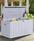 90 Gallon Outdoor Deck Box With Double Wall Resin Construction Weatherproof Storage Chest open on patio with cushions inside