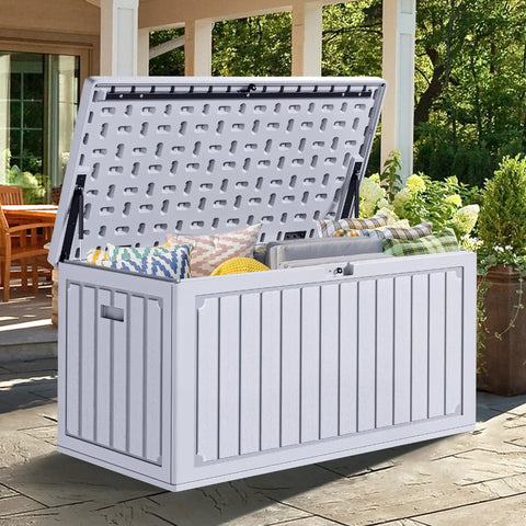 90 Gallon Outdoor Deck Box With Double Wall Resin Construction Weatherproof Storage Chest open on patio with cushions inside