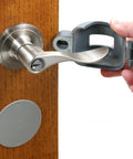 Person installing Doorknob Lock-Out Device With Key Blocks Access To The Keyhole On Round Knobs Up To Two And Seven Eighths Inches Removable And Easy To Use Security Cover For Home Or Office Single Pack on door handle