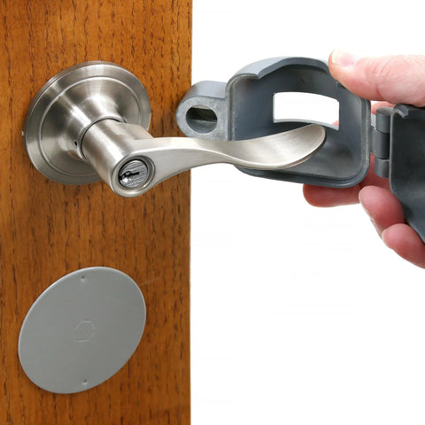 Person installing Doorknob Lock-Out Device With Key Blocks Access To The Keyhole On Round Knobs Up To Two And Seven Eighths Inches Removable And Easy To Use Security Cover For Home Or Office Single Pack on door handle