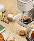 20 Bar Slim Espresso Maker With 1300 Watt Pump And 360 Degree Steam Wand For Silky Microfoam brewing espresso on wooden table.