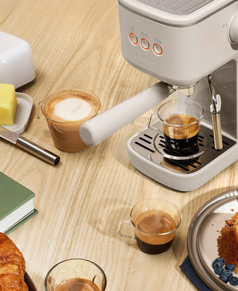 20 Bar Slim Espresso Maker With 1300 Watt Pump And 360 Degree Steam Wand For Silky Microfoam brewing espresso on wooden table.