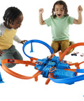 Kids playing with Hot Wheels Criss Cross Crash Track Set With 1 To 64 Scale Car Four Intersections Motorized Booster Power Epic High Speed Crashes And Car Feeder Ramp Amazon Exclusive Toy For Kids.