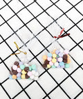 Clear 4x6 Cellophane Bags With 4 Inch Twist Ties, 100 Pack, 1.4 Mil OPP Treat Bags holding colorful candies on a checkered background