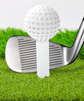 Golf ball on Premium Rubber Golf Tees For Mats And Driving Range 12 Piece Set Includes Six Rubber Tees In 1.5 2 2.5 2.75 3 3.25 Inches Plus Six Bamboo 3.25 Inch Tees Durable Simulator Ready For Outdoor Practice with iron club on grass mat.