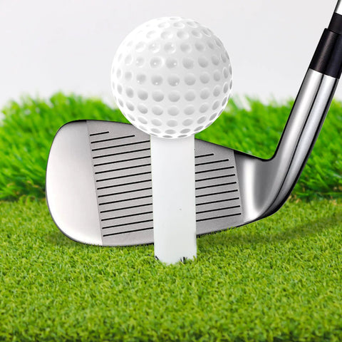 Golf ball on Premium Rubber Golf Tees For Mats And Driving Range 12 Piece Set Includes Six Rubber Tees In 1.5 2 2.5 2.75 3 3.25 Inches Plus Six Bamboo 3.25 Inch Tees Durable Simulator Ready For Outdoor Practice with iron club on grass mat.