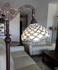 Vintage Tiffany Style Floor Lamp With Jeweled Jagged Edge Arched Design 62 Inch Tall White Tan Stained Glass Shade Classic Cozy Glow For Bedroom Or Living Room LED Compatible 12 Inch Shade Diameter Ideal Gift And Decor next to sofa