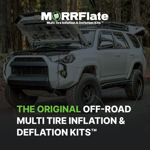SUV with hood open in forest equipped with off-road multi tire inflation deflation kit