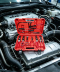 Cool Flex Hose Clamp Tool Set With 9 Piece Disconnect Wrench Kit And Multi Angle Pliers For Gripping Spring Clamps Safely Without Damaging Radiator Or Cooling Hoses On Any Car Under The Hood, red case open in engine bay
