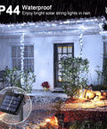 2 Pack Outdoor Solar String Lights With 400 LEDs, 151 Feet, Waterproof illuminating patio in rain with solar panel inset