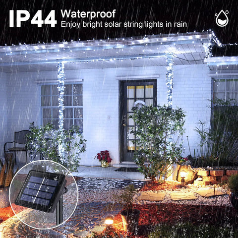 2 Pack Outdoor Solar String Lights With 400 LEDs, 151 Feet, Waterproof illuminating patio in rain with solar panel inset