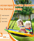 Kids enjoying 40 Inch Saucer Tree Swing for Kids Outdoor Fun with Waterproof Textilene Fabric in backyard