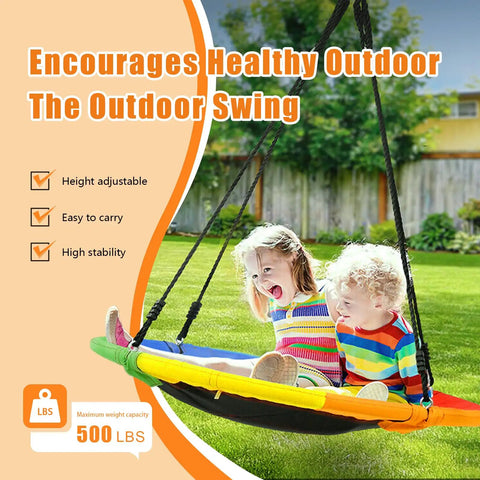 Kids enjoying 40 Inch Saucer Tree Swing for Kids Outdoor Fun with Waterproof Textilene Fabric in backyard