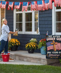 All American 250th Anniversary Garden Flag for Outdoor Use One Nation Under God Cross Design displayed on porch