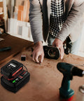 Person using tools with V20 20V Battery Charger With Dual USB Ports For CMCB201 CMCB202 CMCB204 CMCB206 CMCB209 on workbench