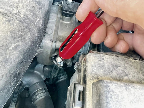 Hand using Dual Size Pocket Pry Bars With Magnet 1/8 Inch And 3/16 Inch Square Shafts 4.5 Inch Long Handy Pry Tools on engine
