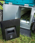 Pro Grade 21 Inch Cordless Self Propelled Lawn Mower with visible grass catcher compartment and black cover on grass.