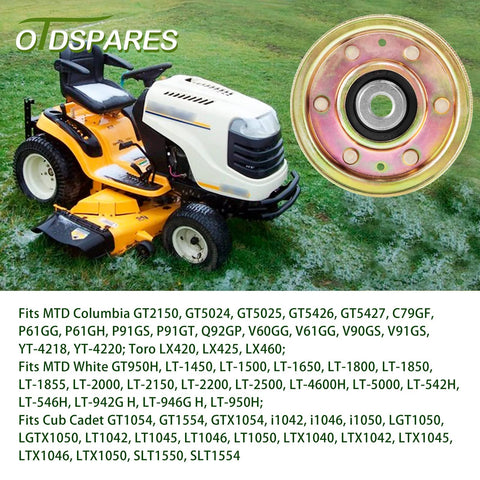 Flat idler pulley close-up (metal, gold-tone) beside a yellow riding lawn mower.
