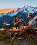 Couple outdoors with Portable Countertop Ice Maker Machine With 8 Cubes In 6 Minutes 26 Lbs Per Day Bullet Ice, enjoying drinks